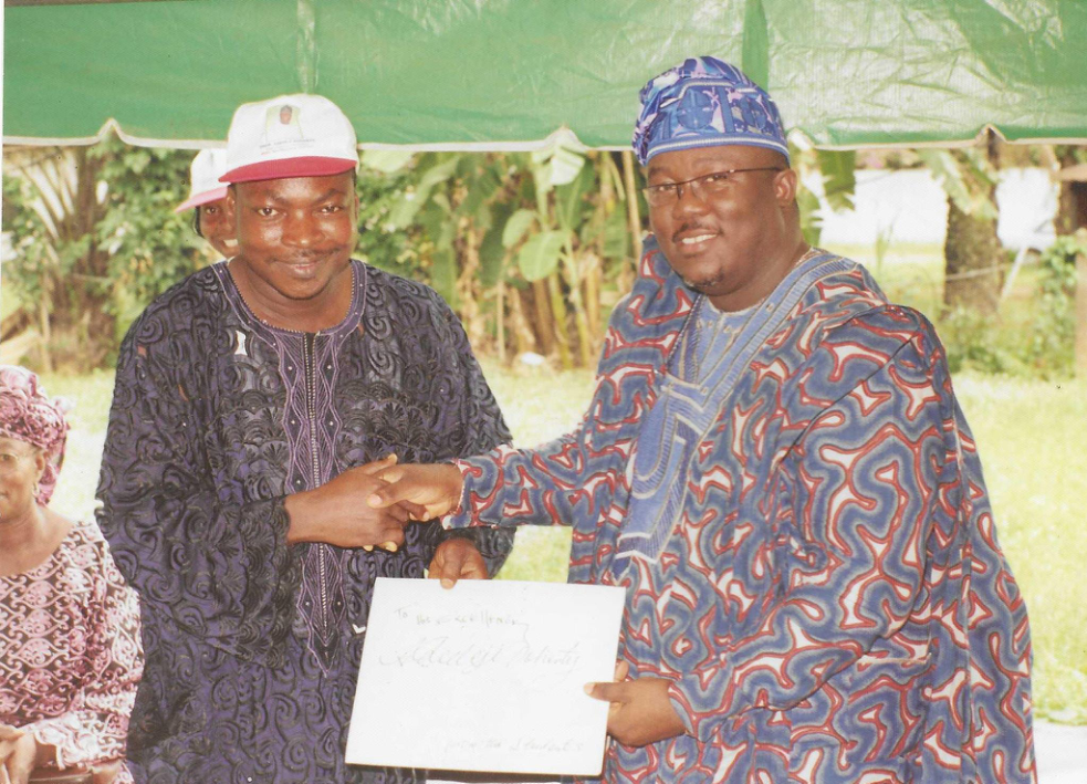 D.D PRESENTING CERTIFICATE TO A STUDENT